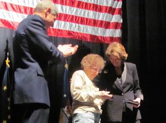 General Norton Schwartz, Chief of Staff of the Air Force, and Sen. Murkowski present Nancy Wood with her Congressional Gold Medal